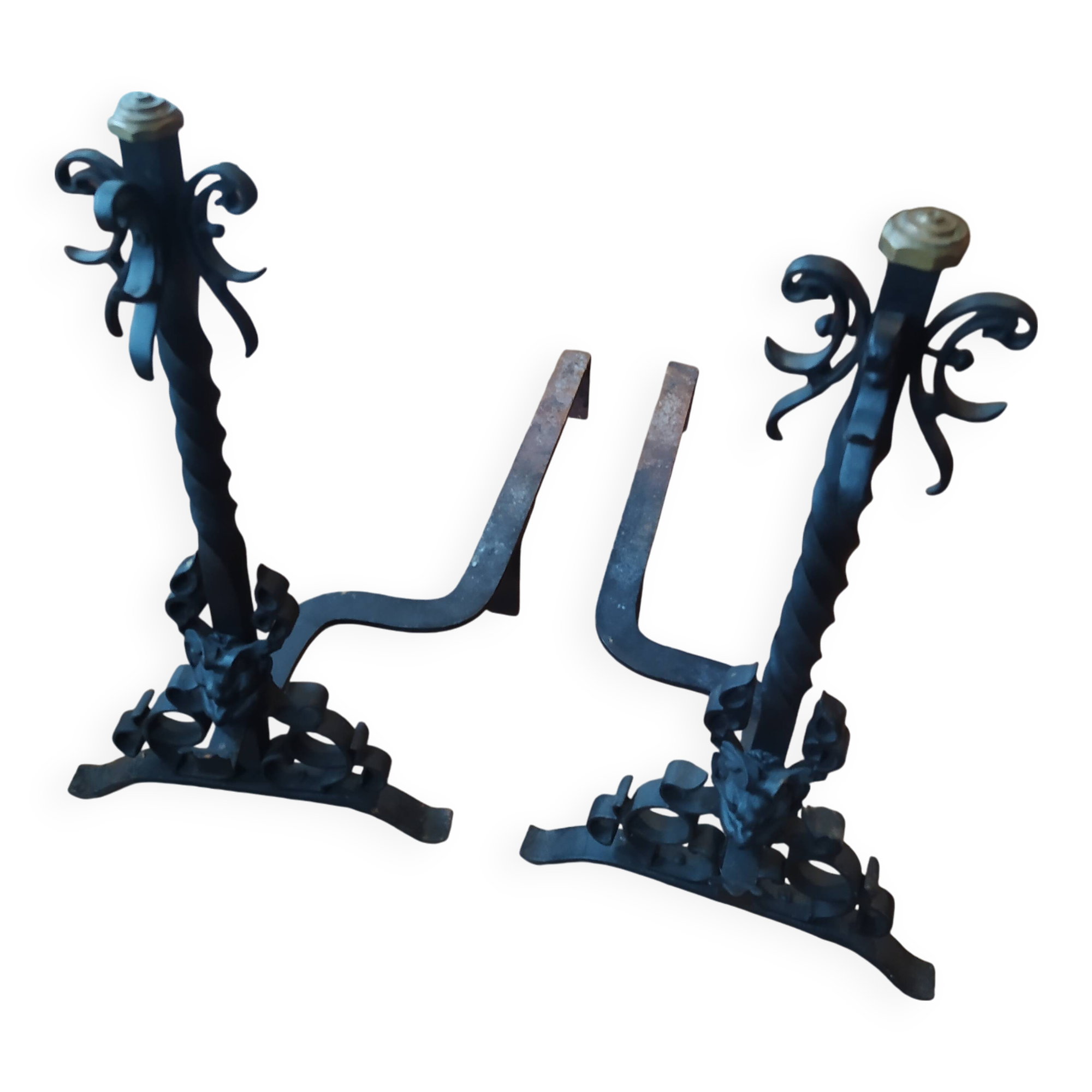 pair of large 20th century metal andirons with mascaron decoration