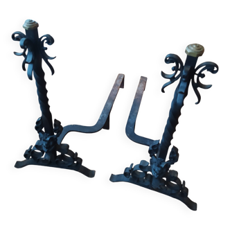 pair of large 20th century metal andirons with mascaron decoration