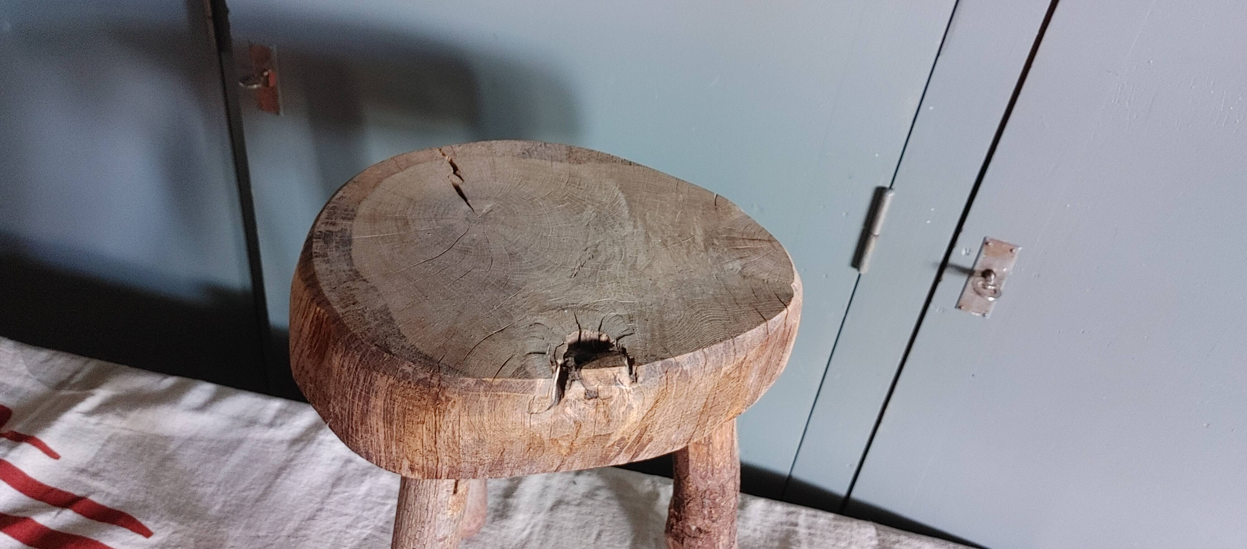 Old small country stool in raw wood - tripod base