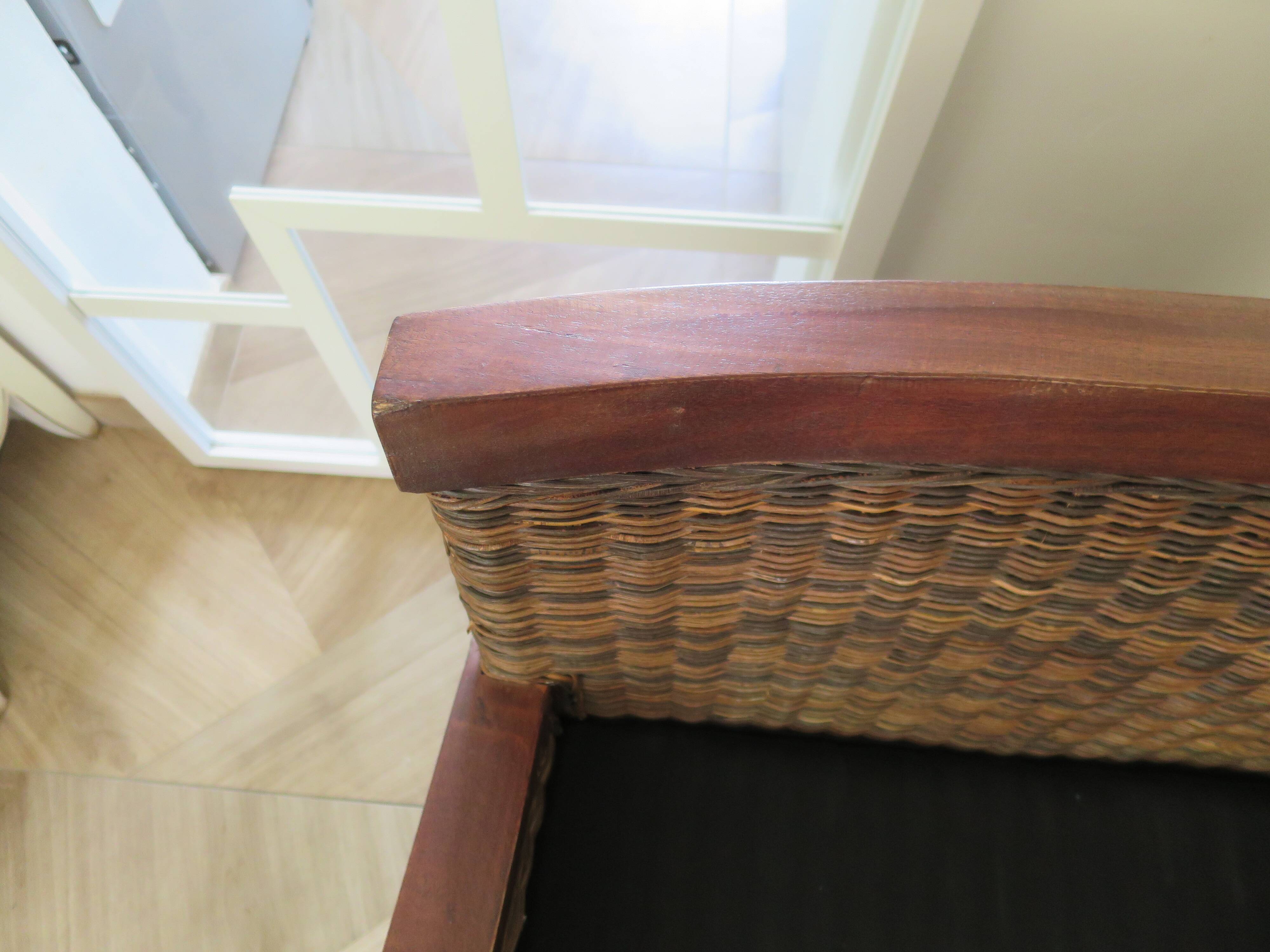 2 colonial-style armchairs in woven rattan and exotic wood