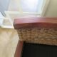 2 colonial-style armchairs in woven rattan and exotic wood