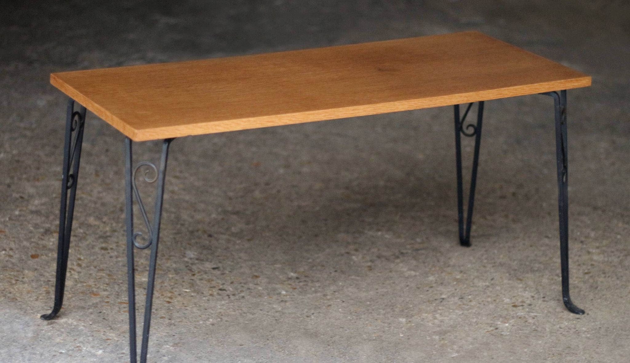 Nice vintage coffee table (1970s). Made of plywood and cast iron.
