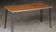Beautiful vintage coffee table (1970s). Made of plywood and cast iron.
