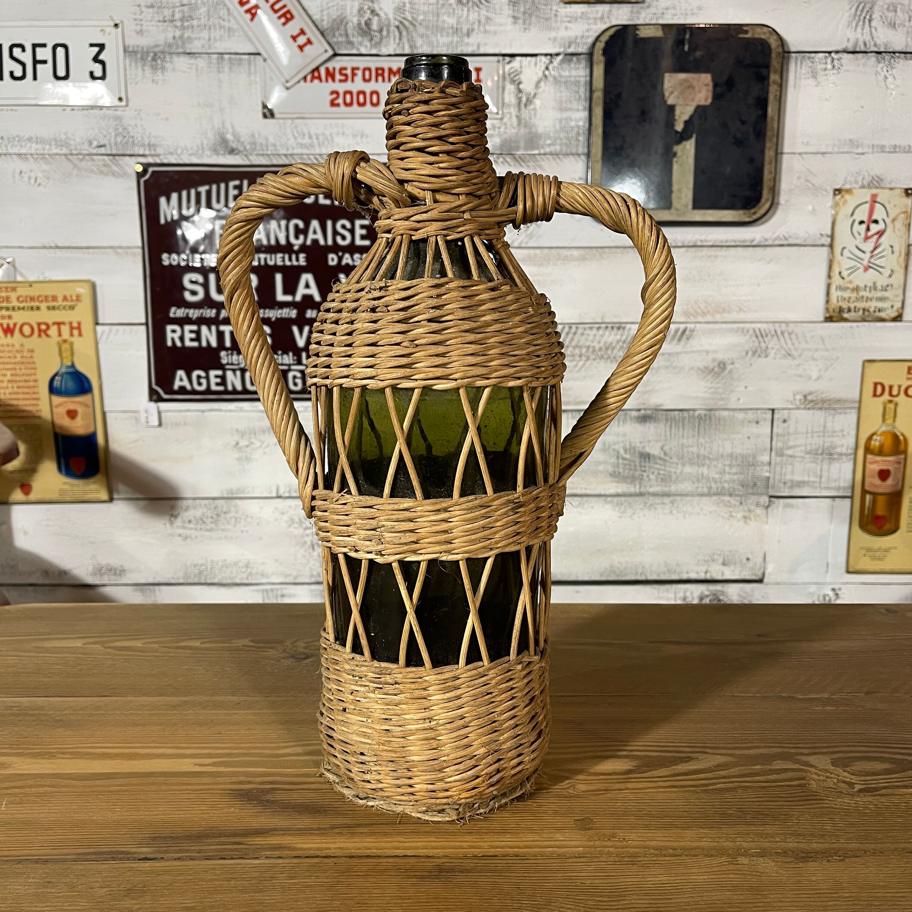 Braided wicker green bottle