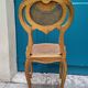 Antique rococo chair in gilded wood and caning