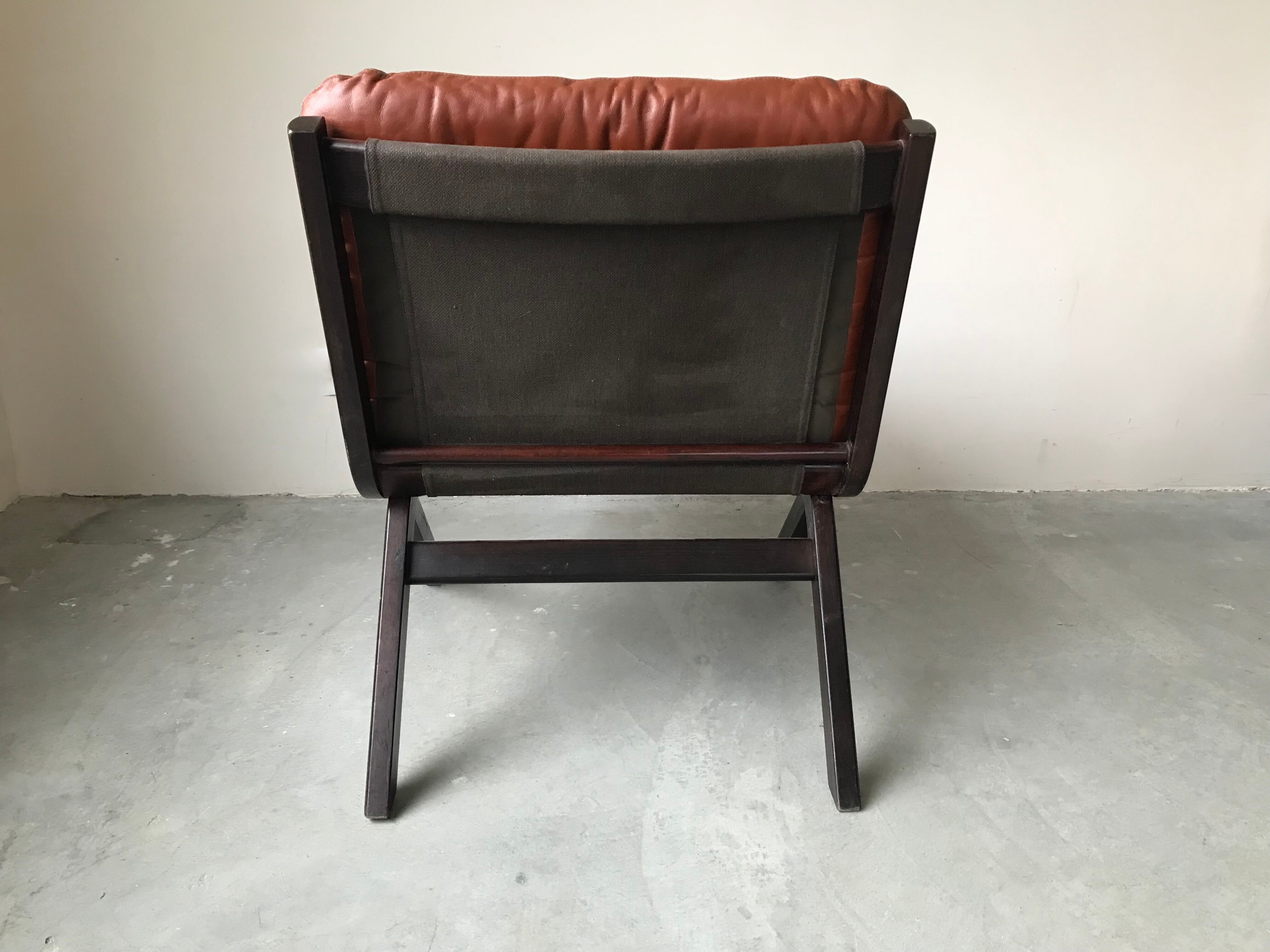 Scandinavian folding armchair in cognac leather