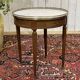 Louis XVI style bouillotte table from the 1960s in mahogany with a marble top.
