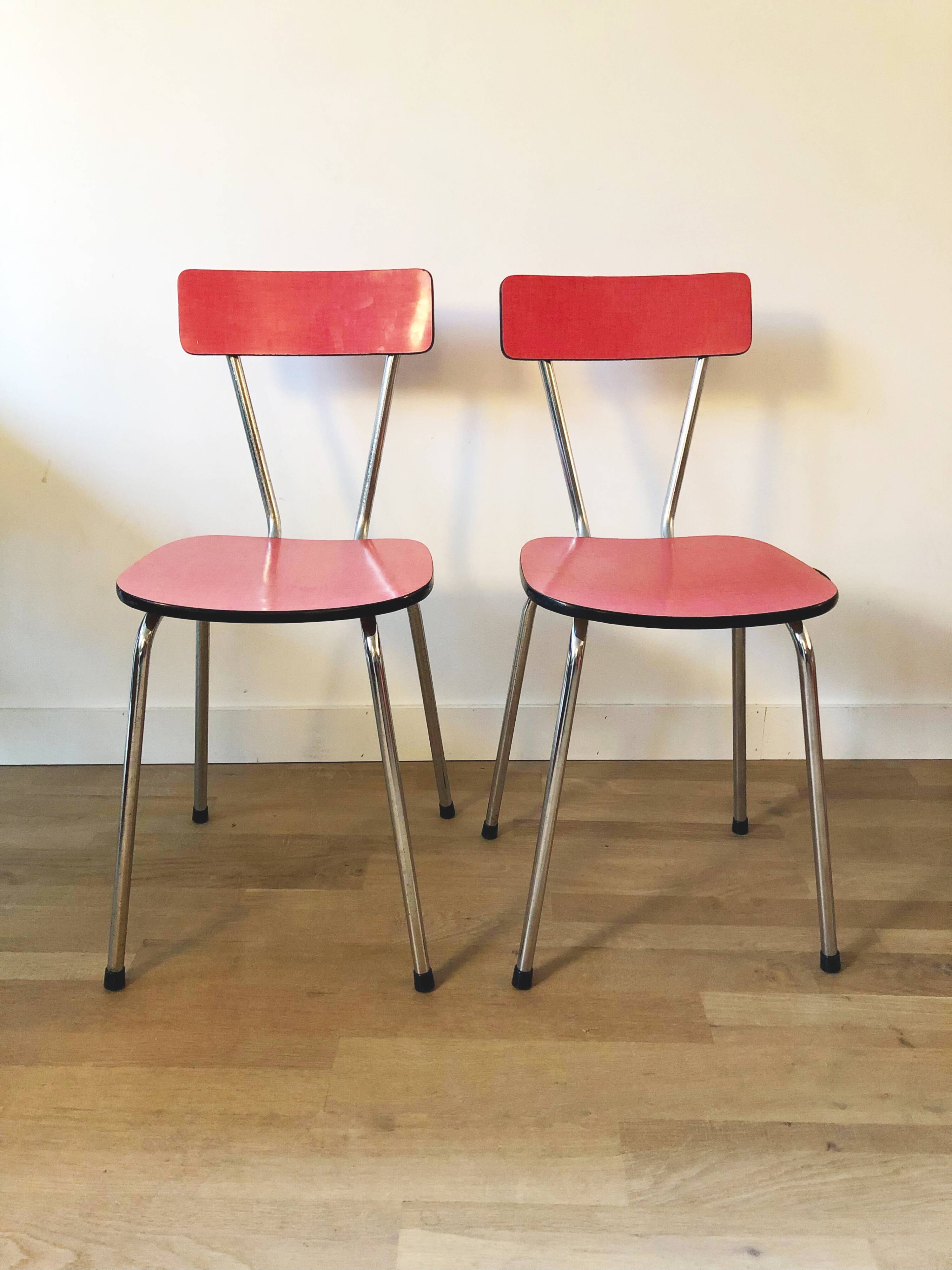 Duo of red formica chairs