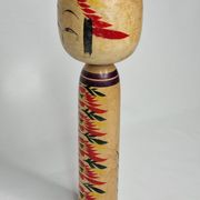 Japanese Kokeshi doll dated 1986, signed and numbered, hand-painted multi-colored floral decoration,