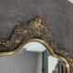 Miroir Louis XV en bois doré à cartouche