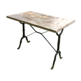 Inlaid bistro table with cases of wine.