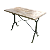 Inlaid bistro table with cases of wine.