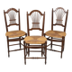 3 wooden and straw chairs, decorated with a sheaf of wheat.
