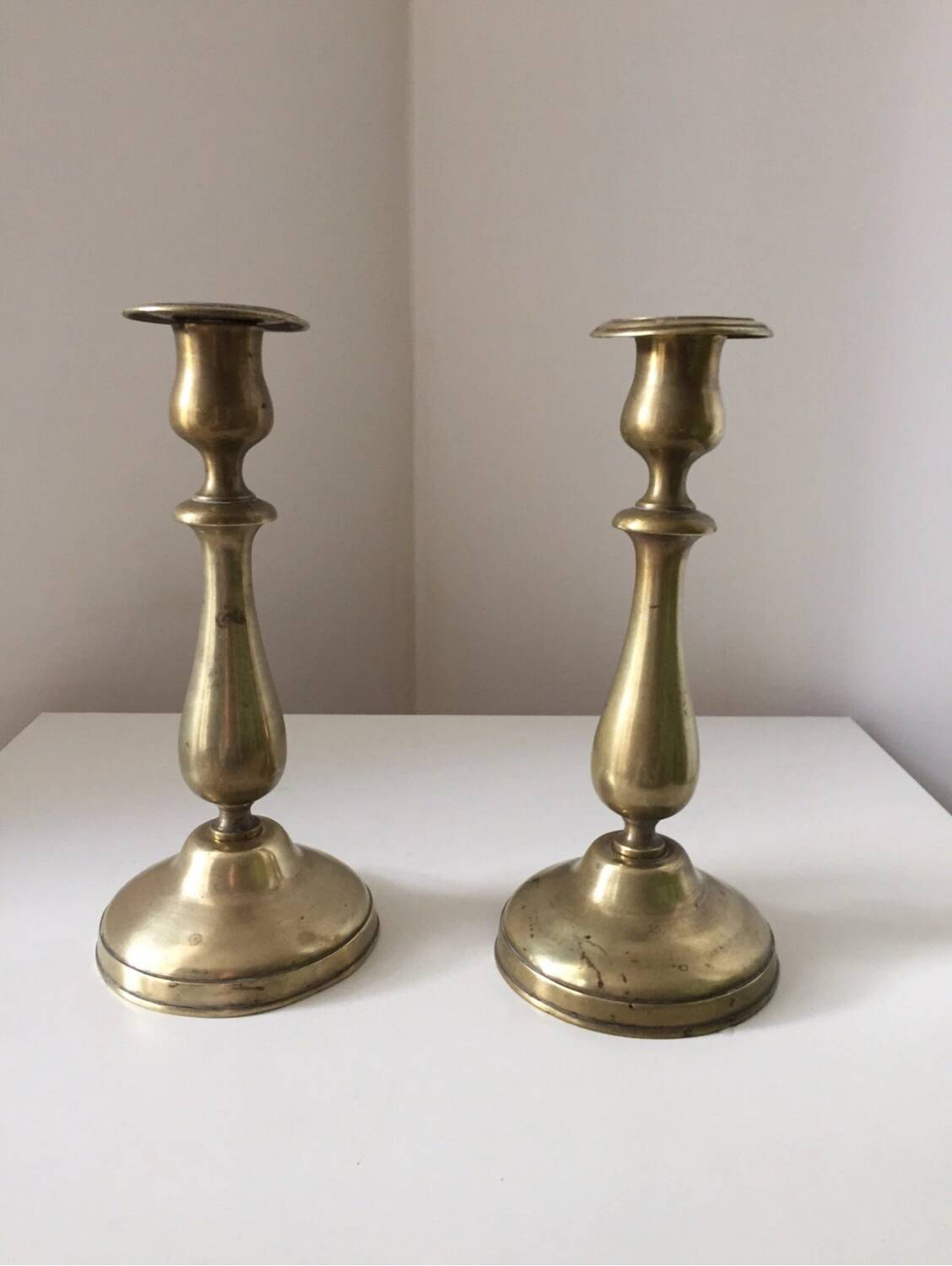 Pair of antique gilt brass candlesticks