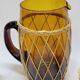 Vintage orangeade service in amber blown glass and wicker