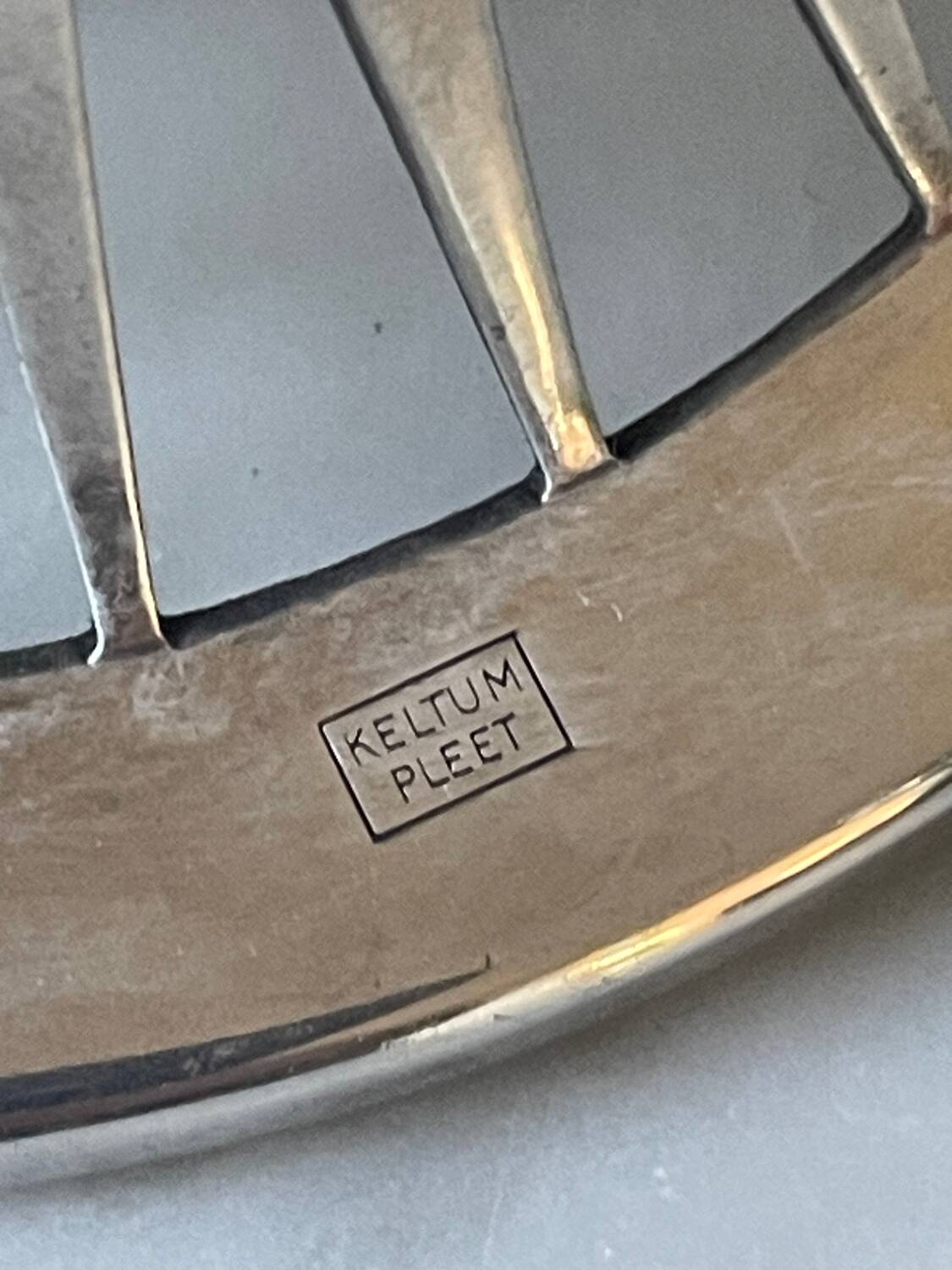 Pair of Keltum Pleet silver metal candlesticks