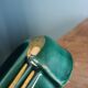 Poët Laval knife rest in emerald green ceramic and gold.