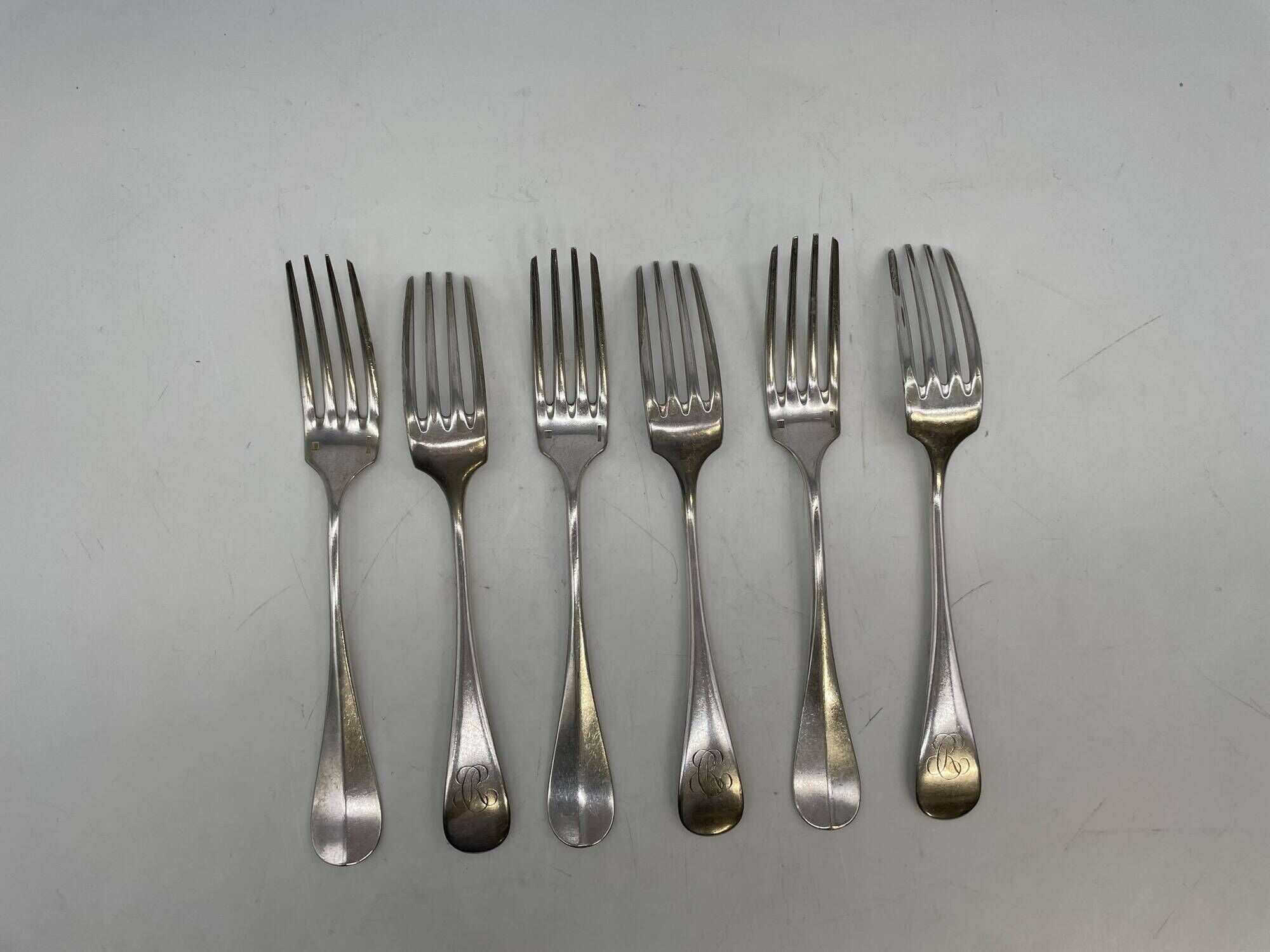 Set of 2 soup spoons and 5 lunch forks by Christofle.