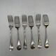 Set of 2 soup spoons and 5 lunch forks by Christofle.