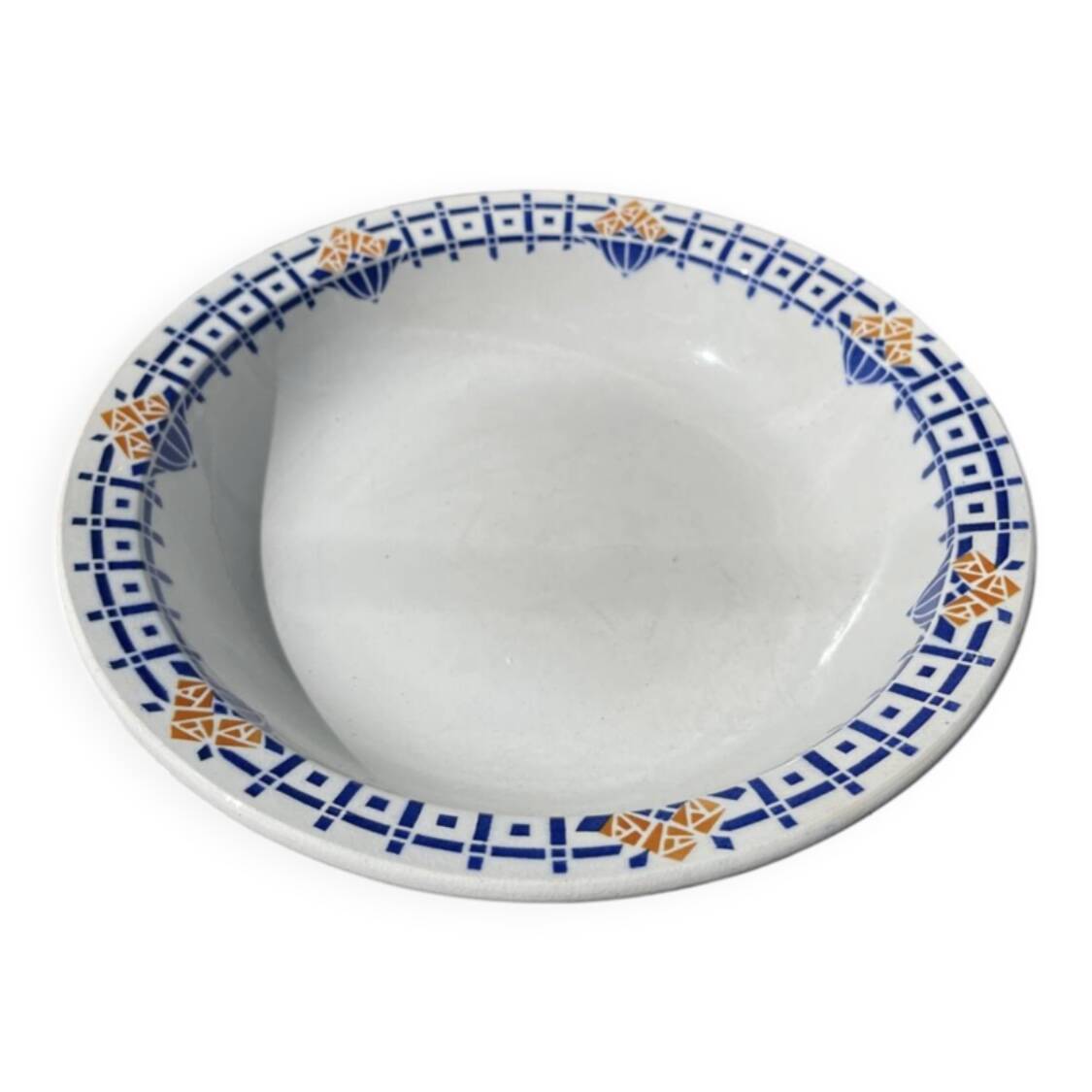 Round, shallow ceramic salad bowl from Saint Amand