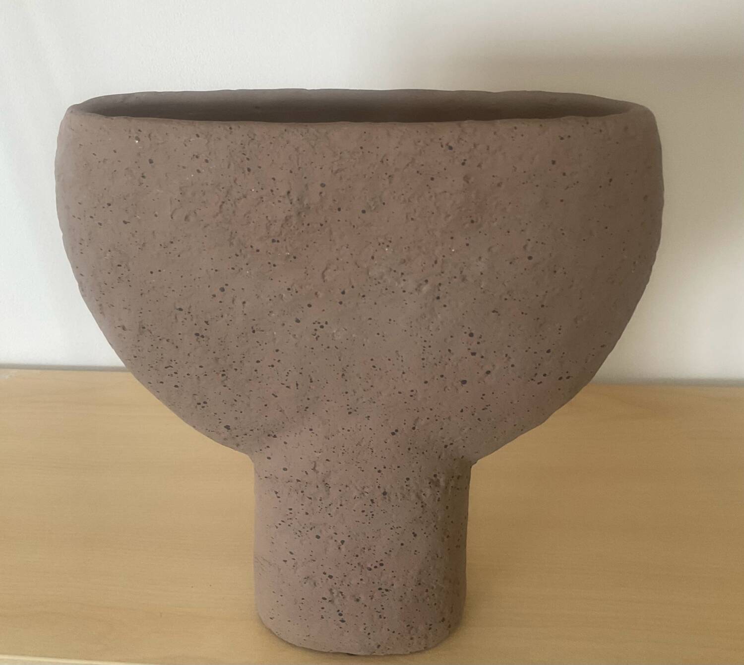 Vintage vase made of raw clay
