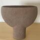 Vintage vase made of raw clay