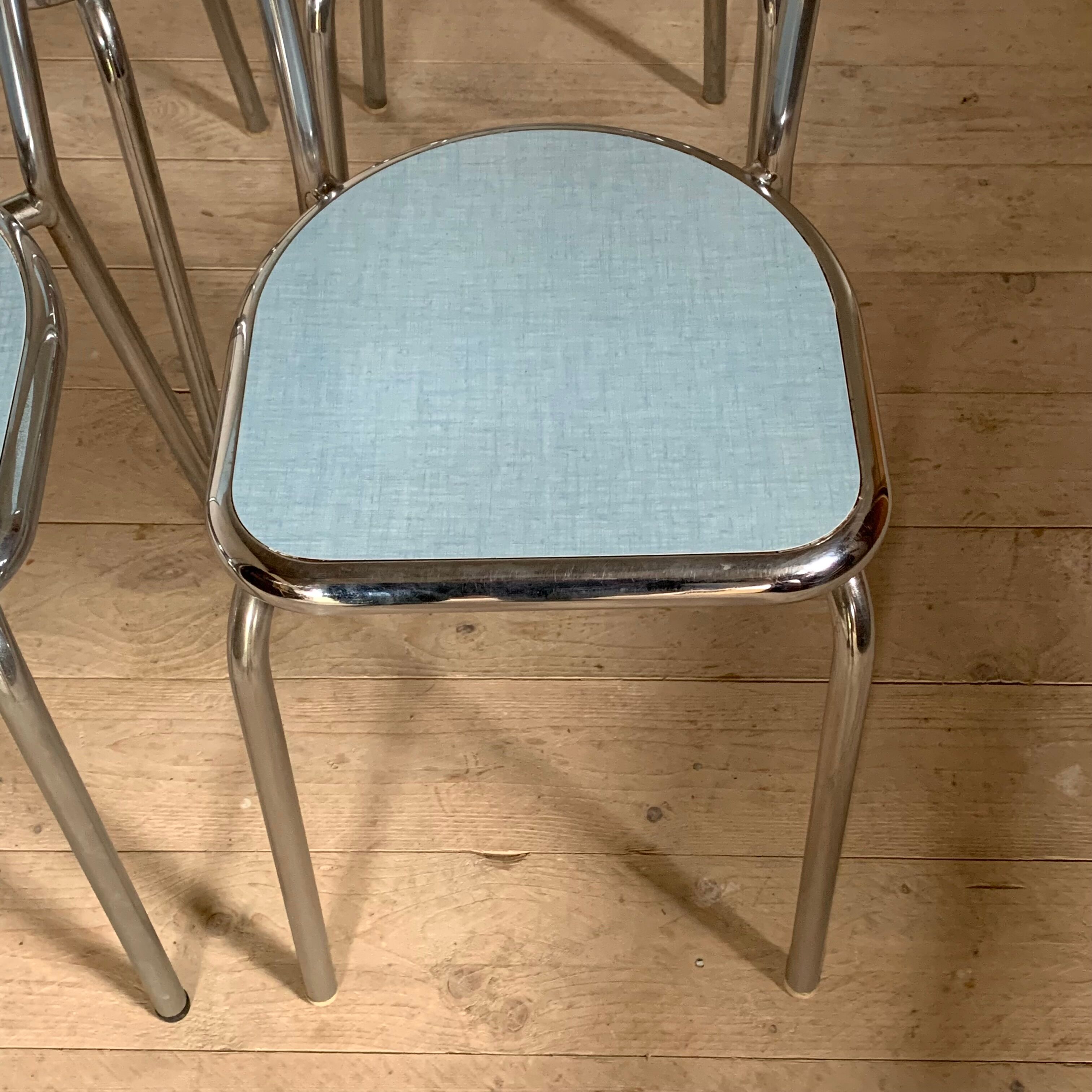 Blue formica table and its 4 chairs