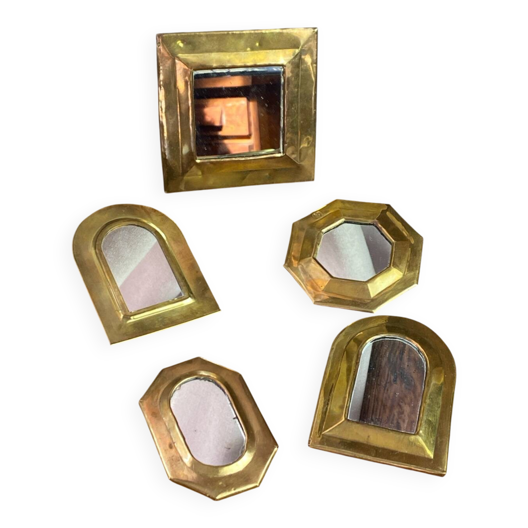 Set of five small wall mirrors in brass.