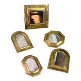 Set of five small wall mirrors in brass.