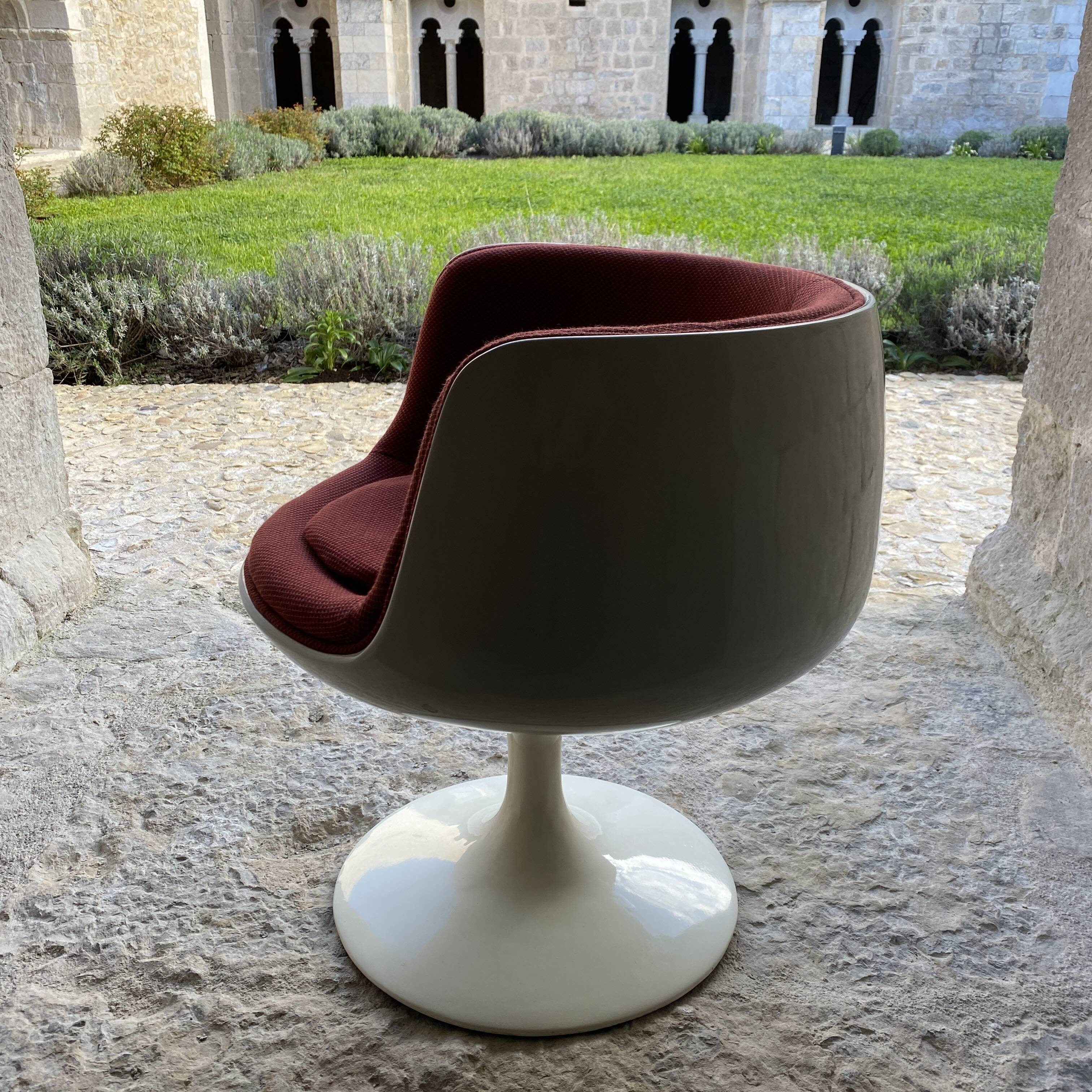 Two cognac-colored swivel chairs made of fiberglass from the 1970s