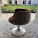 Two cognac-colored swivel chairs made of fiberglass from the 1970s