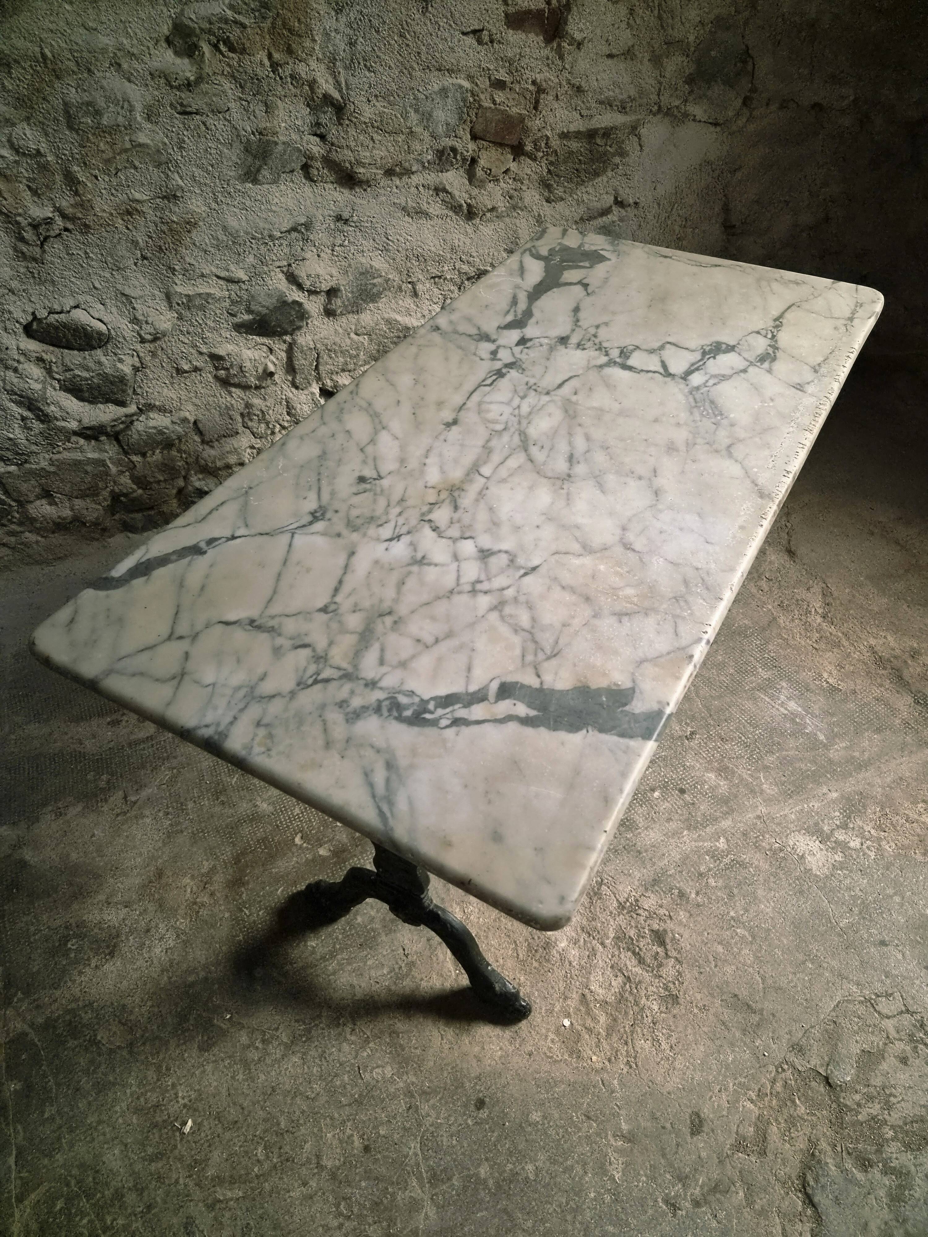 French bistro table made of marble with a cast iron base, 1920s–1930s.