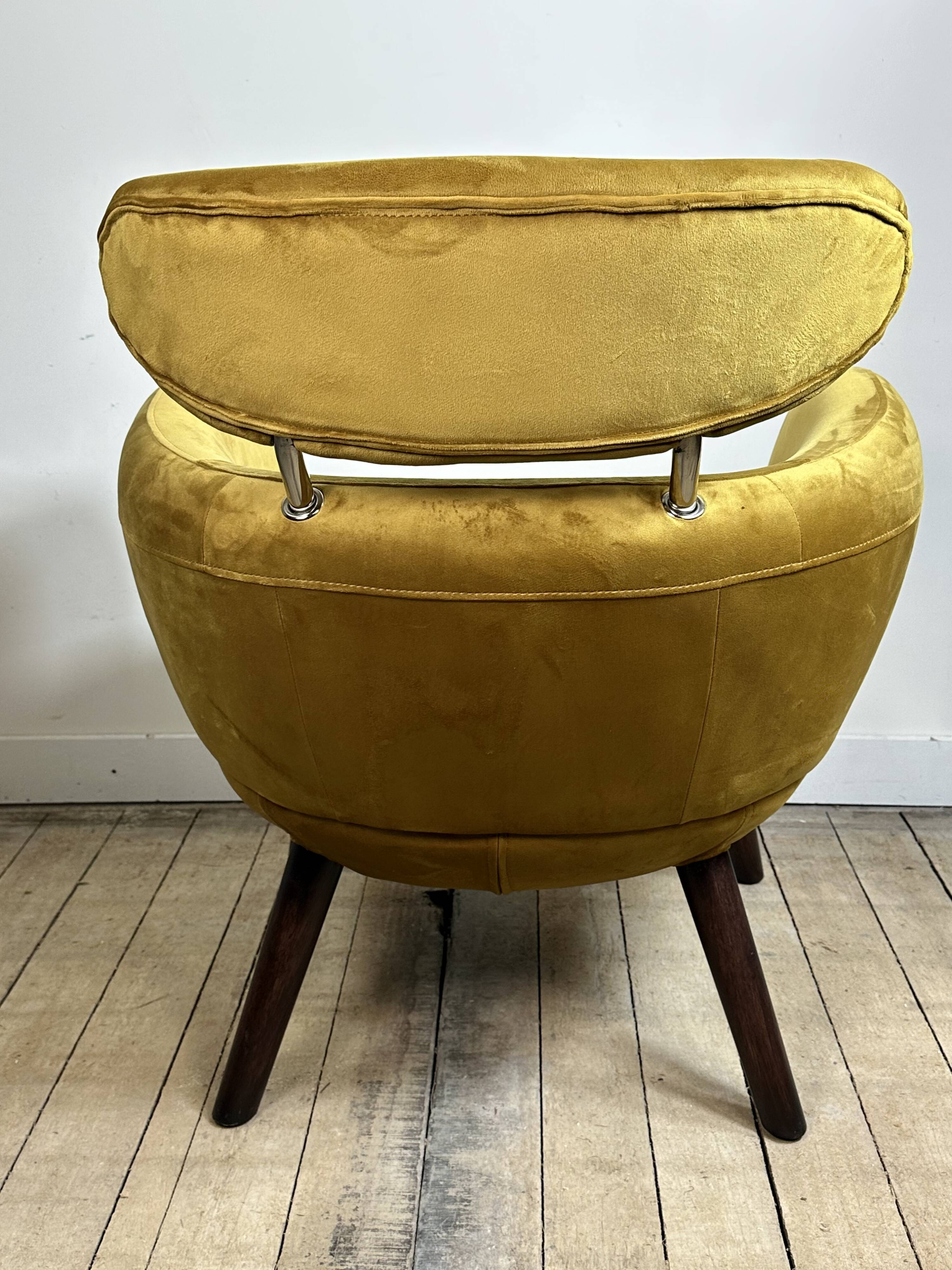 Mustard yellow velvet armchair from the 2010s.