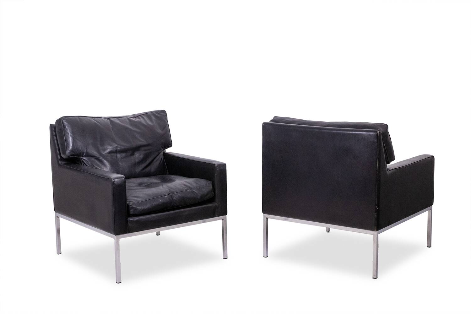 Pair of armchairs in black leather and chrome metal. 1970s.