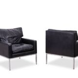 Pair of armchairs in black leather and chrome metal. 1970s.