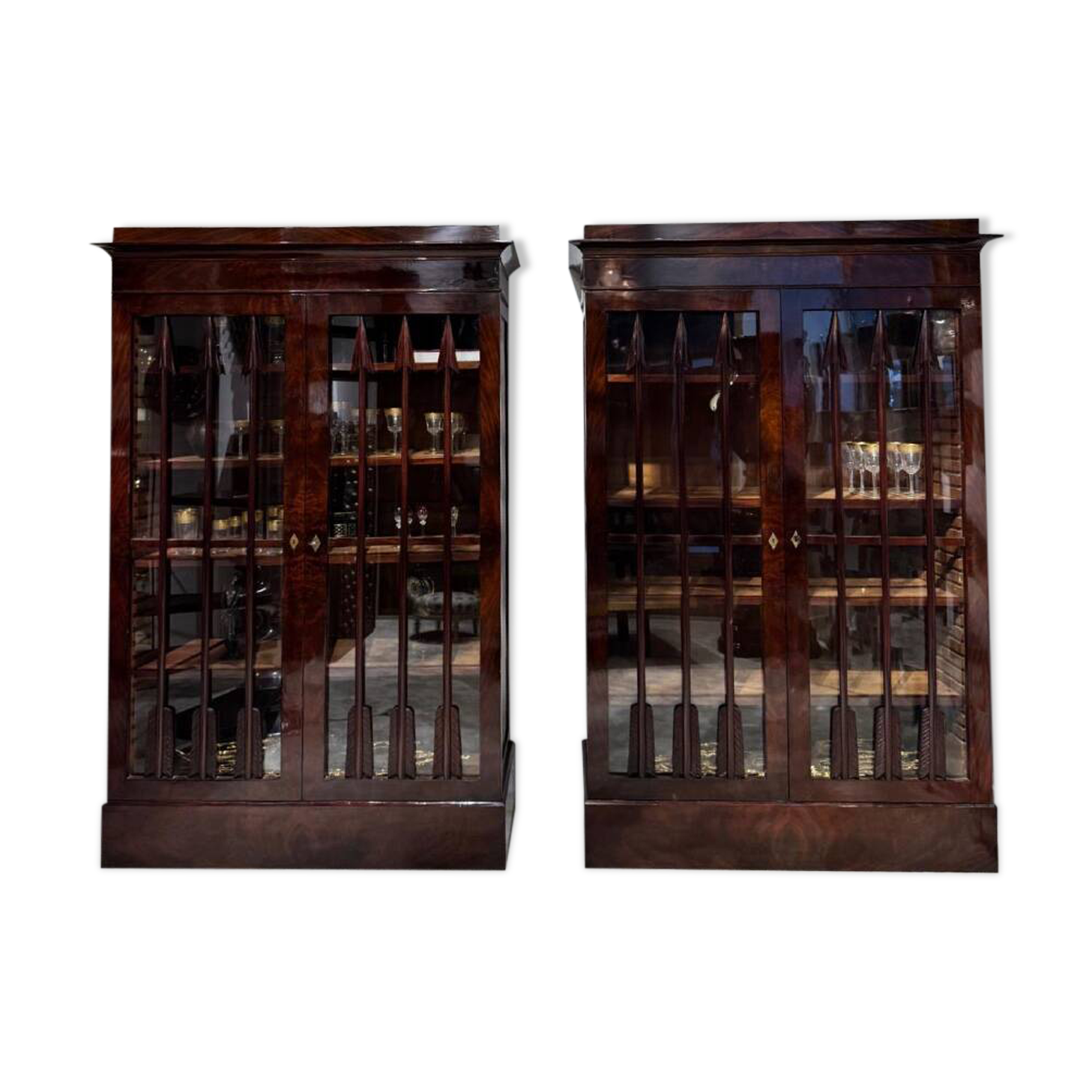 Pair of Empire period mahogany bookcases with flame grain, 19th century.