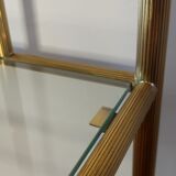 Bedside table in brass and glass.