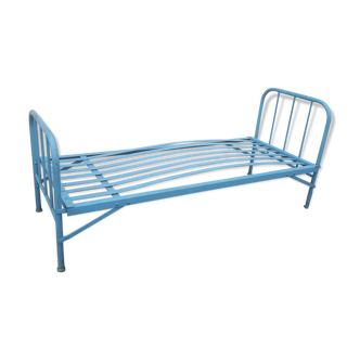 Blue iron bed.