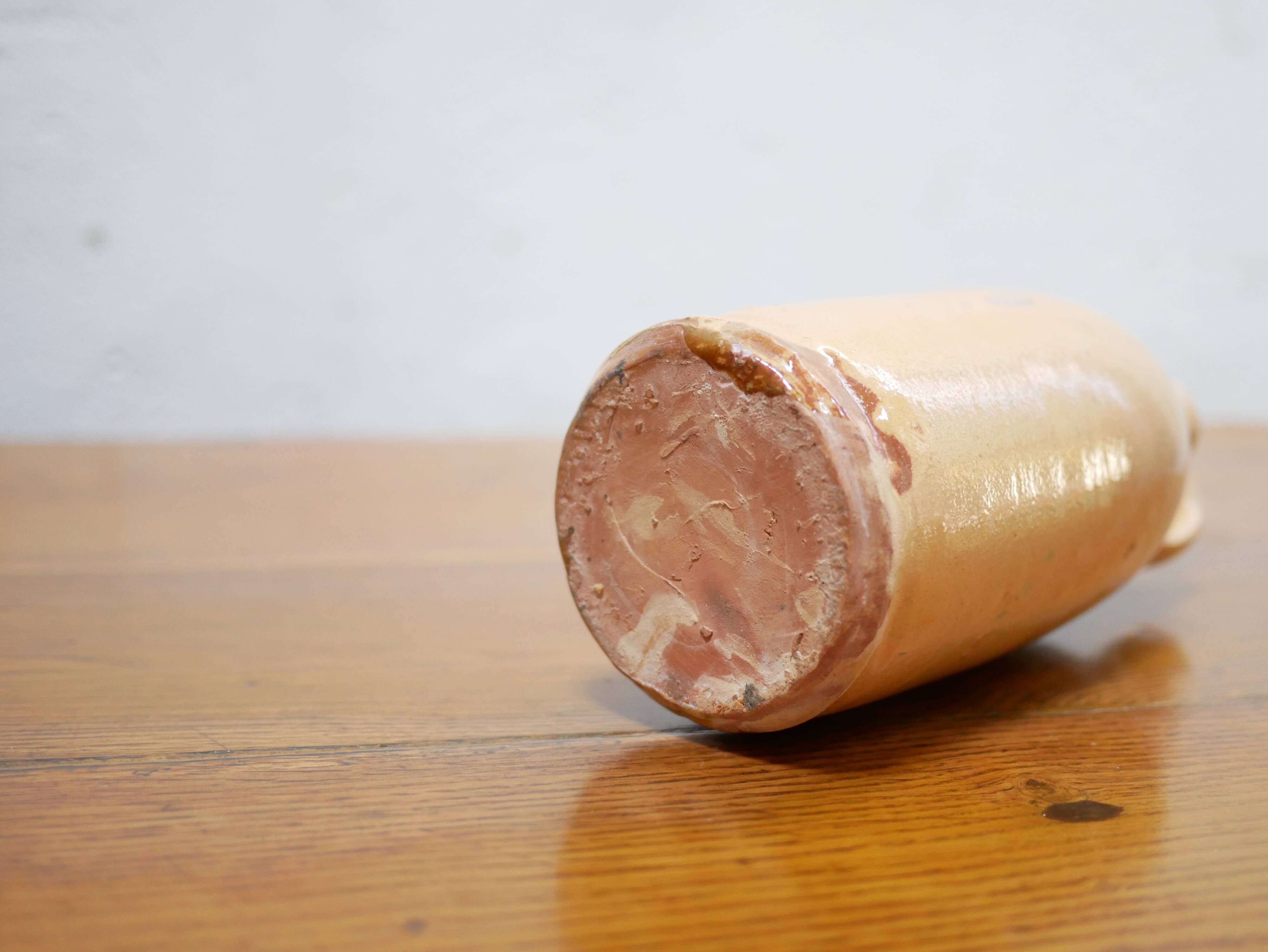 Vintage glazed terracotta bottle