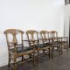 Serie de 4 fauteuils de style directoire à dossier en palmette