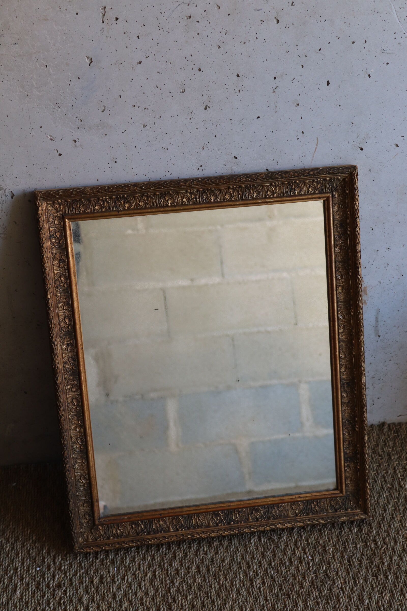 Antique mirror in wood and stucco