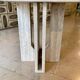 Round travertine dining table by Claude Berraldacci