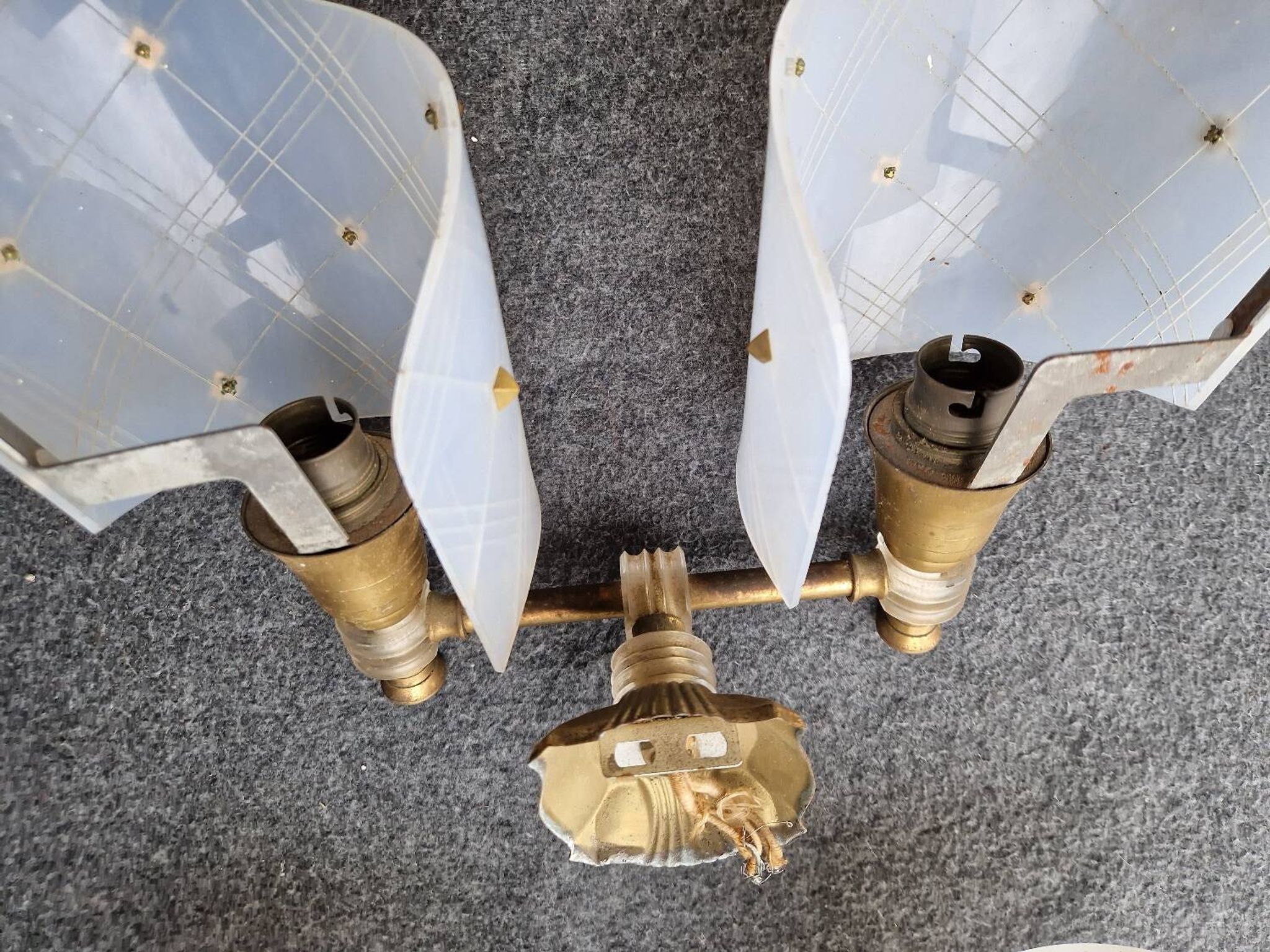 Pair of plastic and brass wall lights from the 60s/70s.