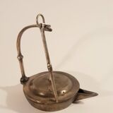 Old oil lamp in golden brass to hang
