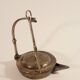 Old oil lamp in golden brass to hang