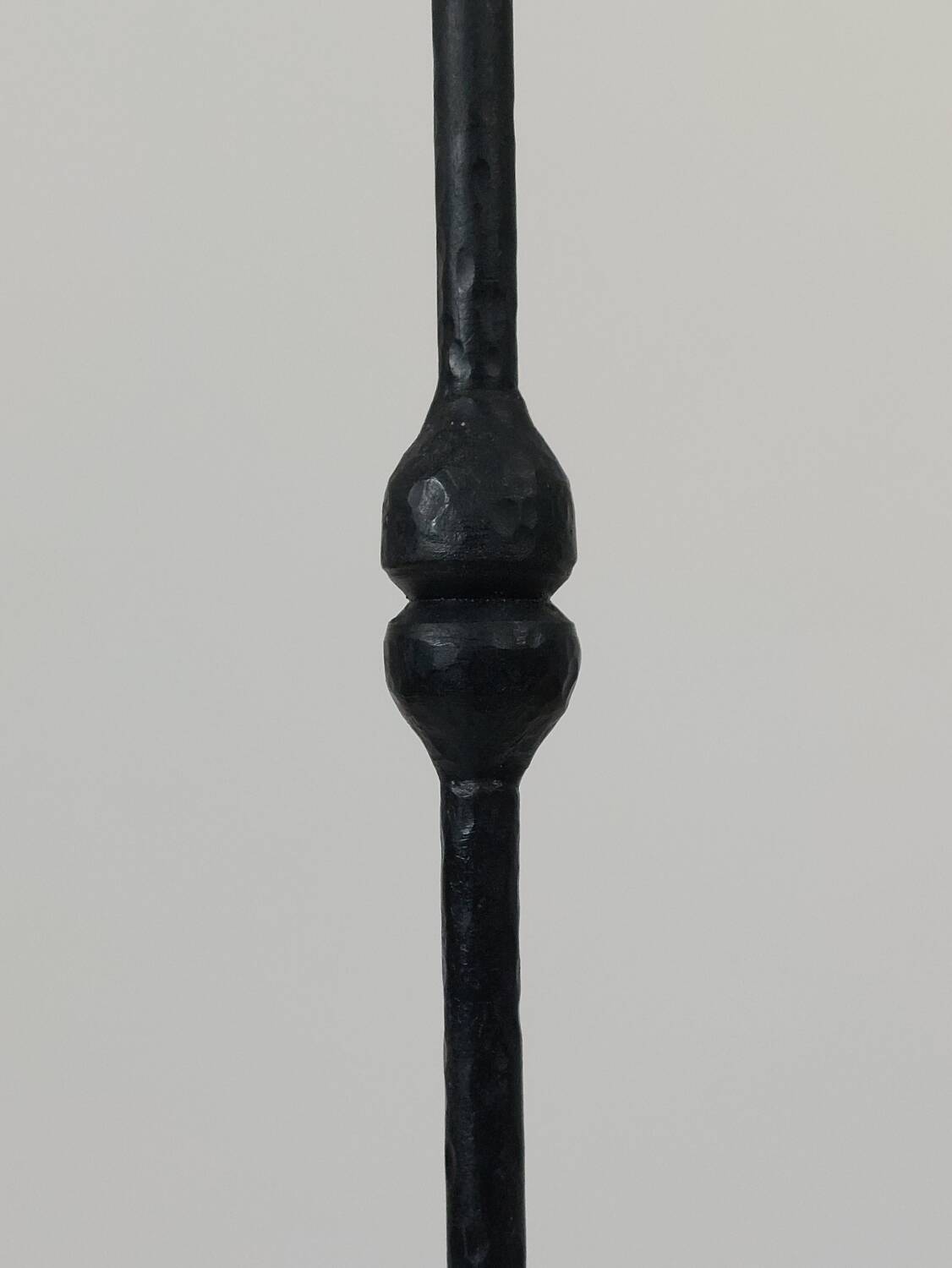 A pair of beautiful and exquisite vintage wrought iron candlesticks from the mid-century.