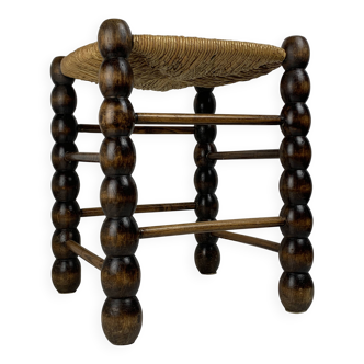 Brutalist wood turned bobbin rush stool in the style of Charles Dudouyt