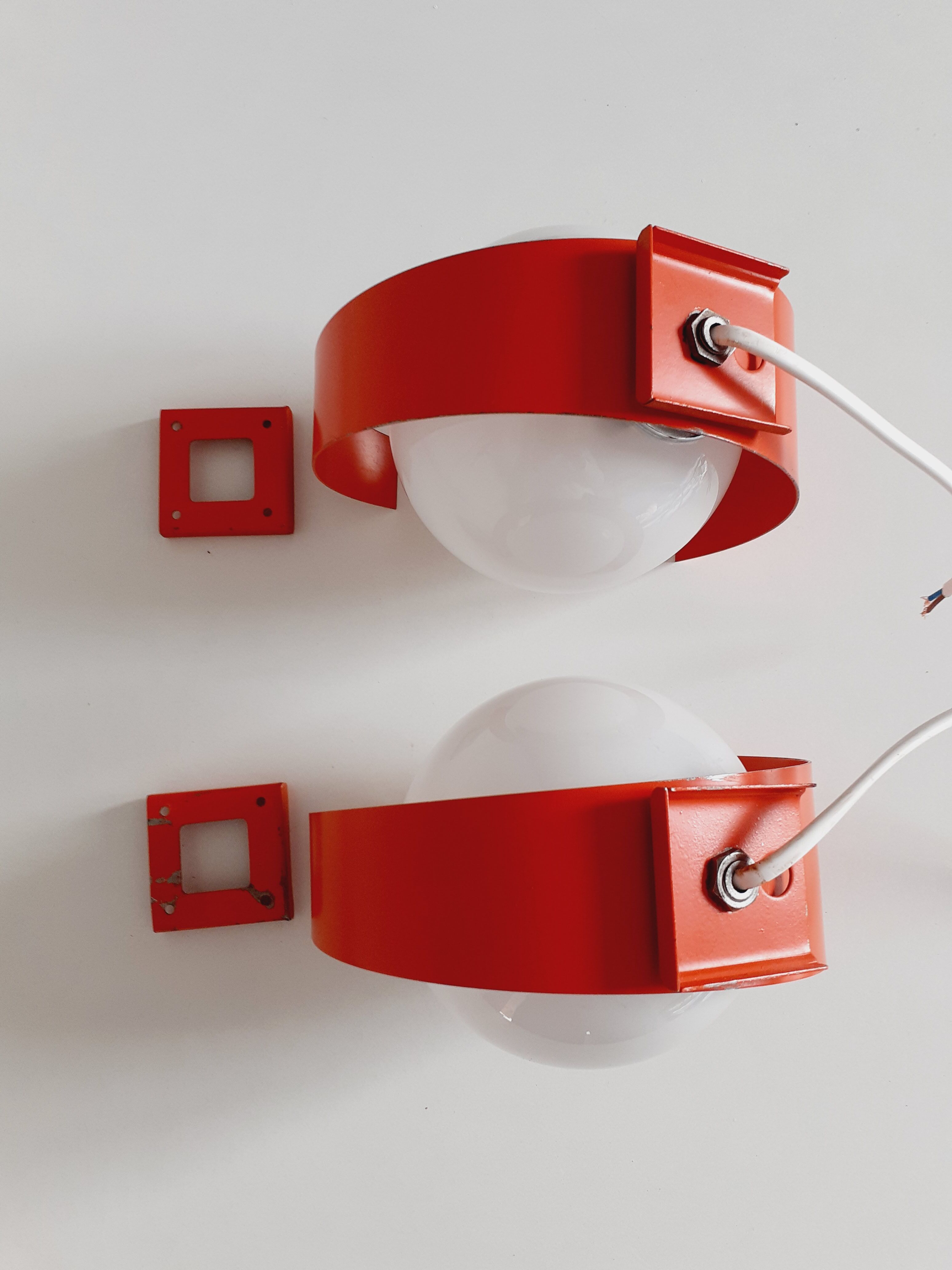Pair of orange space age wall lamps