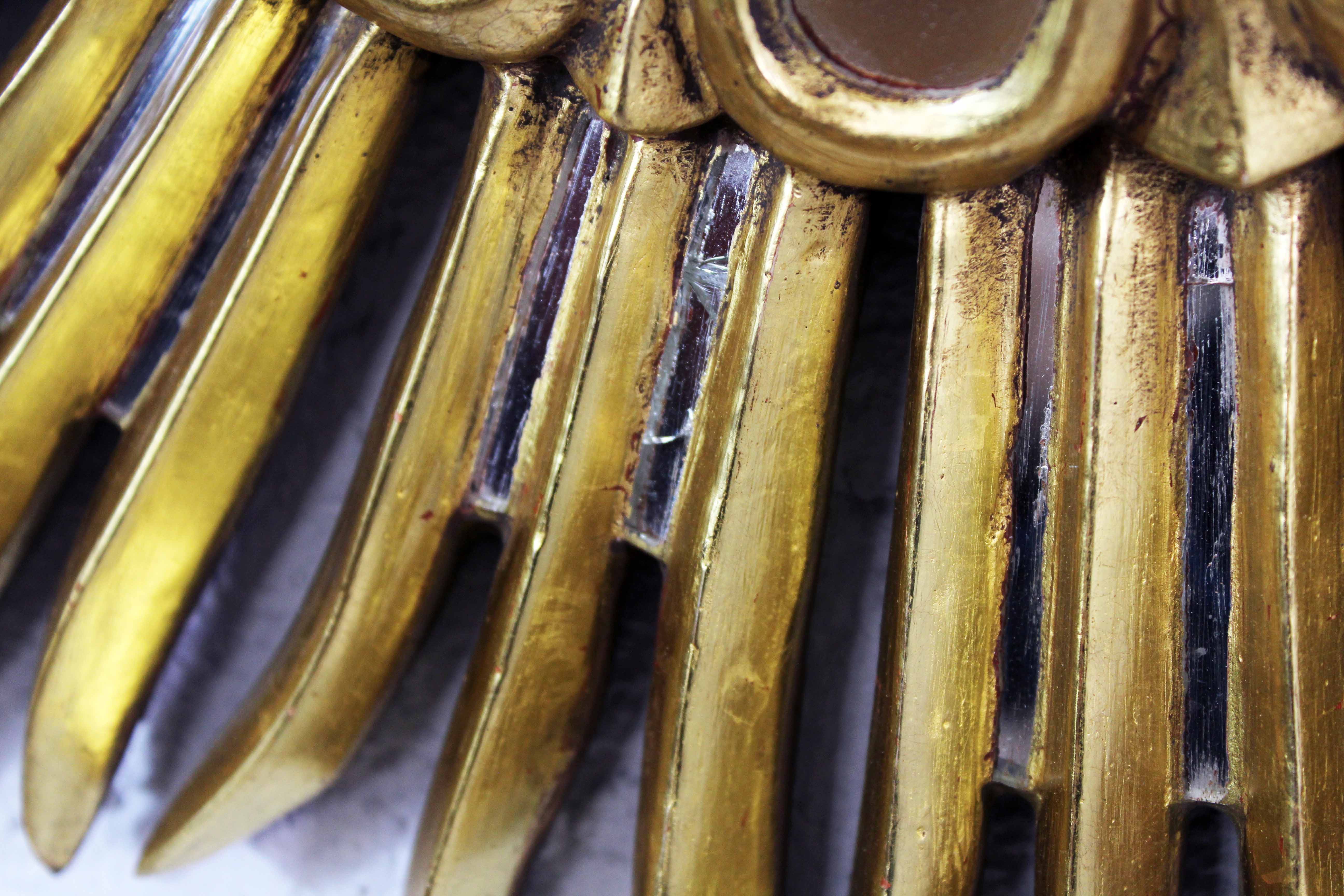 Sun mirror in wood and gilded stucco