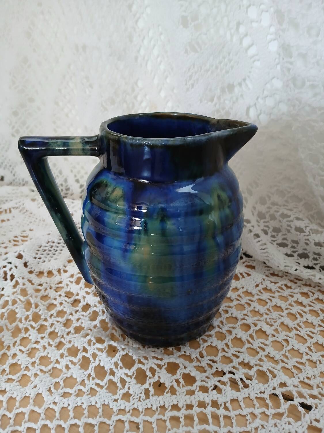 Antique pitcher in enamelled ceramic